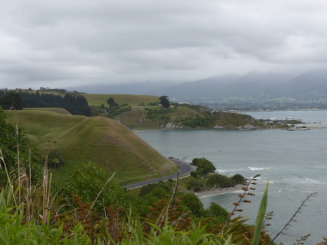 Site of a Maori "Pa" with ridges in the grass on the top of the hill at left in Kaikoura, Nov 2015